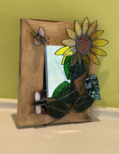 Sunflower on a wooden mirror