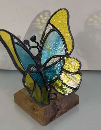 3D butterfly ornament on a wooden base