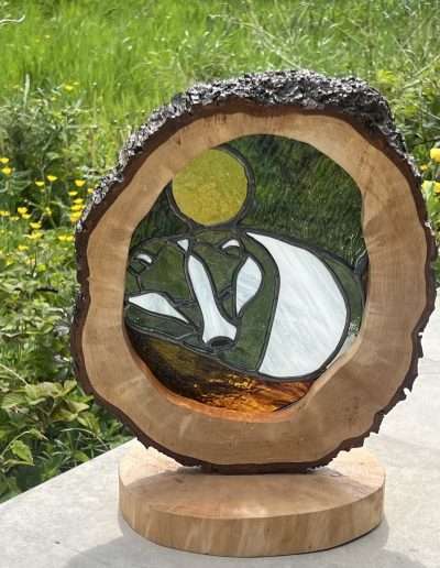 Stained glass badger in a rustic wooden frame and base