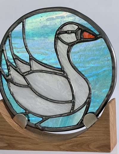 Stained glass swan on an oak wooden base