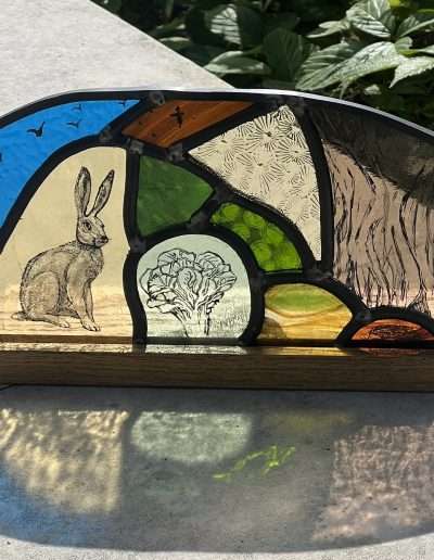 Stained glass leaded art panel on a wooden base