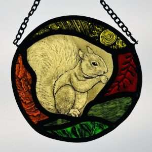 Hand painted stained glass sun catcher of an Autumn squirrel