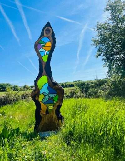 Stained glass and wood garden sculpture with kingfisher and fish hand painted details
