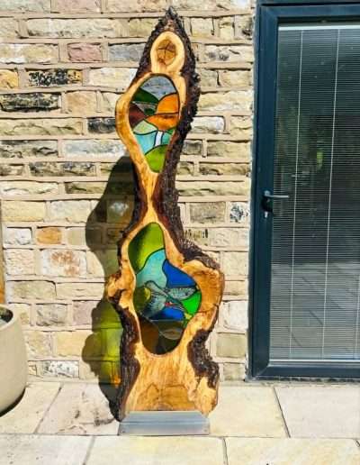 Stained glass and wooden sculpture