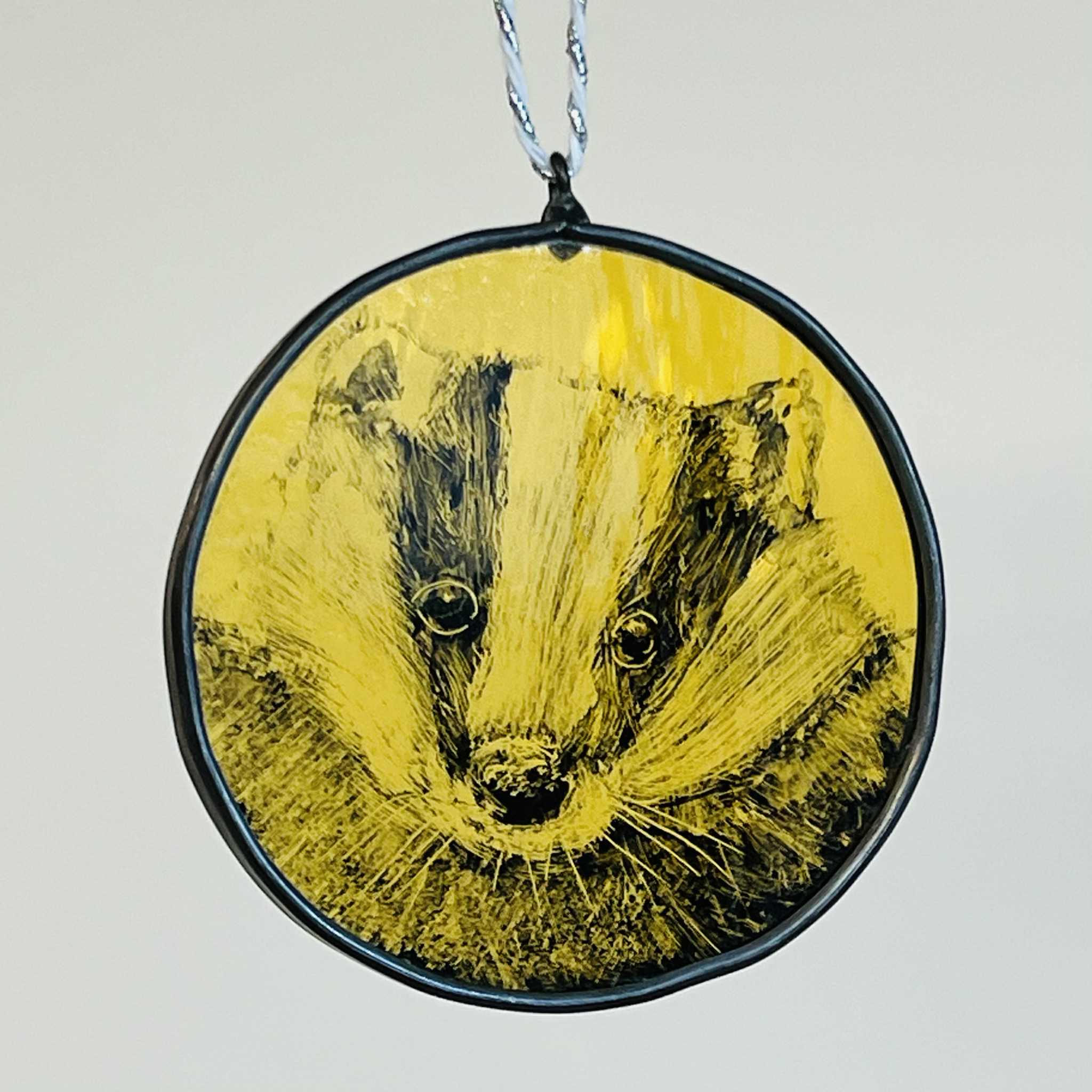 Painted stained glass badger token